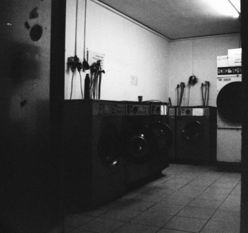 Public Laundry. Camera: Nikon FE. Film: Kodak Tri-X 400 @ 3200. Location: Tel Aviv, Israel.
